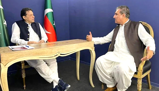 Picture released on June 7, 2023, shows former foreign minister Shah Mahmood Qureshi speaking with former premier Imran Khan.