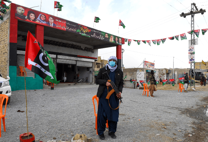 Security personnel stand guard near PPP election office in Quetta.
